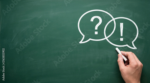 Question and answer concept. Hand drawing speech bubbles with question and exclamation marks with copy space