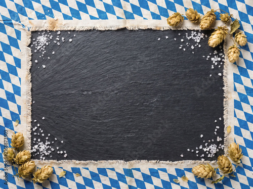 Traditional Blue and White Bavarian Diamond Cloth Framing Dark Slate with Coarse Salt and Hops