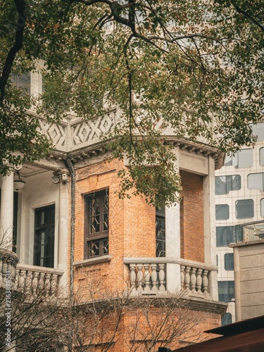 Photography Historic brick corner turret framed by autumn foliage, Xintiandi, Shanghai