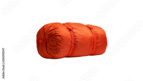 Orange compressed sleeping bag for camping gear with tightly secured two on transparent background