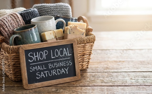 Gift basket with handmade soap mugs and knitted blankets for small business saturday
