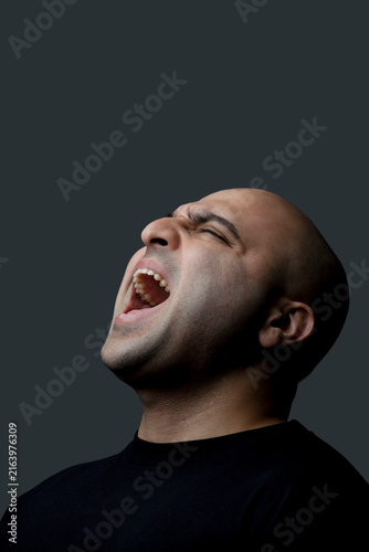 Bald man screaming 