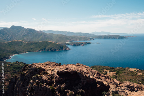 Wild rocky coastline and crystal-clear turquoise waters in Corsica