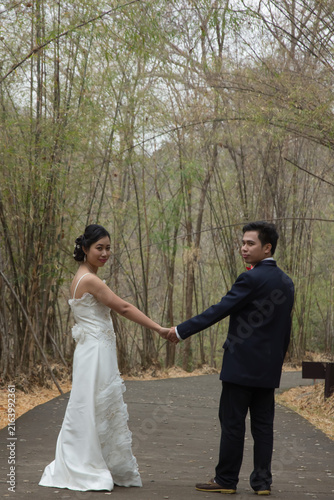 asia marry wed on road in bamboo forest