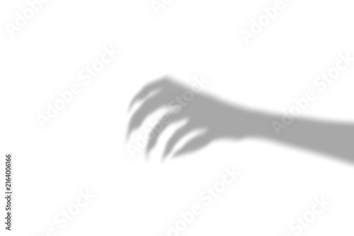 Canvastavla A dark silhouette shadow of a scary monster hand with sharp claws reaching out o