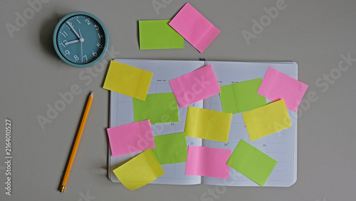 Multiple sheets sticky notes on notebook. brainstorm, planning concept.