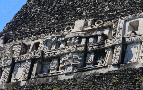 Obraz na płótnie Macro cutout of the Xuantunich Maya Ruin frieze with blue sky, Belize