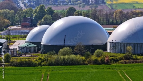 фотографія Biogas Digesters and Solar Farm in Rural Agricultural Landscape