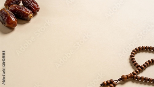 Ramadan Kareem Concept with Dates Prayer Beads and Copy Space on Beige Background