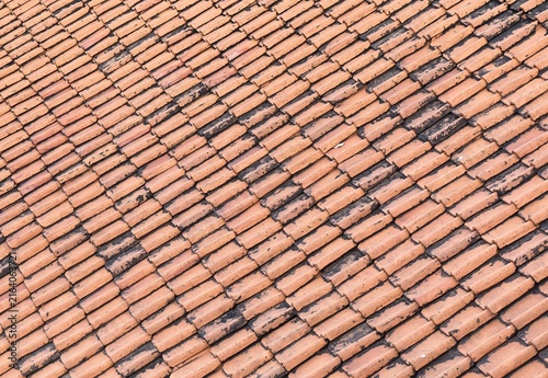 Obraz na płótnie Close up texture of weathered terracotta roof tiles in diagonal rows