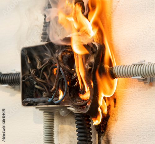 Quadro su tela Fire in an electrical box occurs due to faulty wiring during an inspection in a