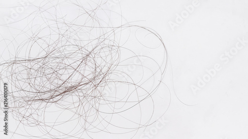 Clump of fallen brown hair isolated on white background