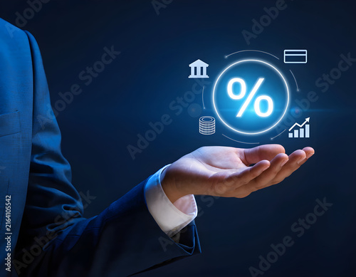 Financial Interest Rate Percentage Icon Glowing over Businessman Hand