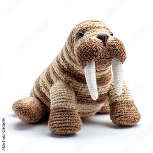 Cute Knitted Walrus Stuffed Animal Toy In Brown And White Yarns Isolated On A Bright White Background