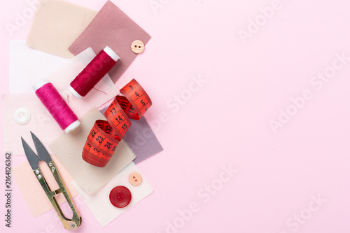 Photography Sewing and needlework accessories on color background, top view