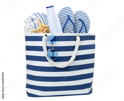 Beach bag with accessories isolated on white