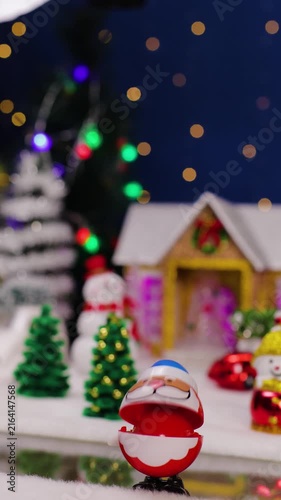 An unusual Santa Claus drops by a Christmas village