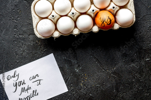 concept of correct choice eggs on dark background top view