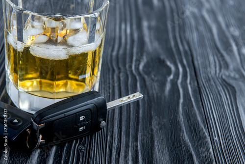 concept of alcohol and driving on wooden background