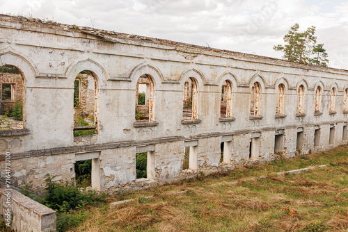 Quadro su tela Ruin of old abandoned historical building with many windows, decayed architectur