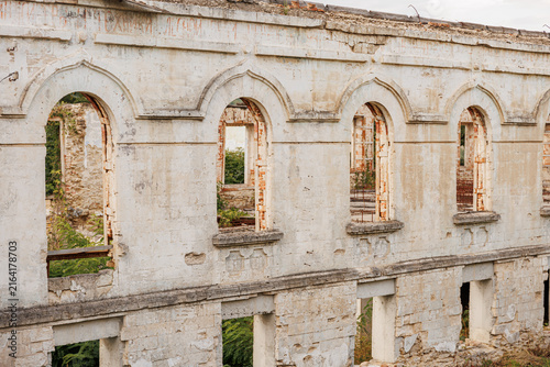 Konstfotografi Ruin of old abandoned historical building with many windows, decayed architectur