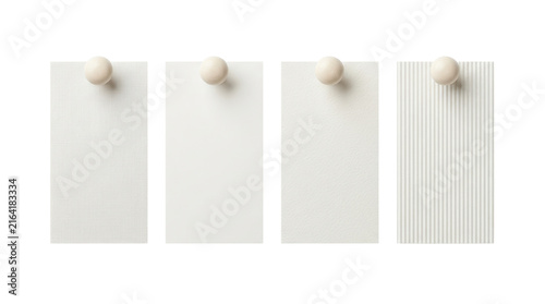 Four textured off-white paper swatch cards pinned with wooden knobs on white