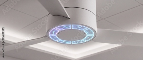 Futuristic white ceiling fan base features glowing circular holographic light display panels for intelligent airflow control in modern rooms