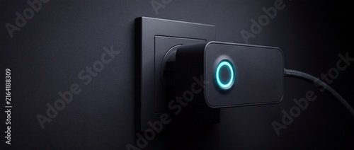 Smart power adapter with glowing cyan ring indicator plugged into wall socket for energy monitoring and remote electrical device control