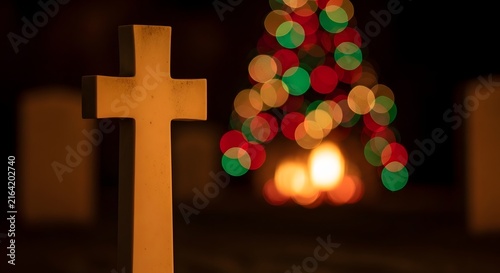A solemn stone cross stands in soft focus against a blurred backdrop of festive Christmas tree lights, evoking a sense of remembrance and holiday spirit