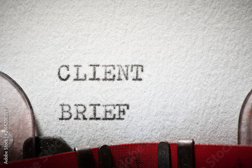 Client brief text written with a typewriter.