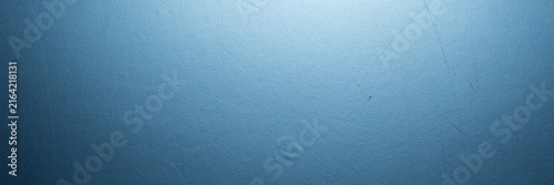 Minimalist blue gradient background with soft light, textured matte surface in deep navy and azure tones, professional abstract backdrop for corporate presentations and digital design