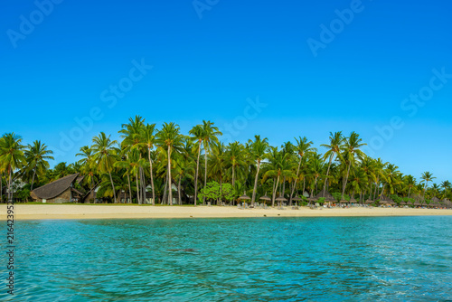 Tropical Beach with Turquoise Lagoon and Palm Trees in Mauritius