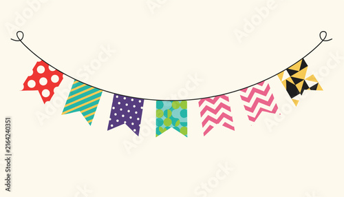 Colorful party bunting flags hanging on a string line, featuring various geometric patterns for festive holiday or celebration decor.