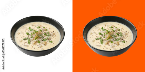 Creamy potato soup in a black bowl with fresh herbs and pepper seasoning transparent png
