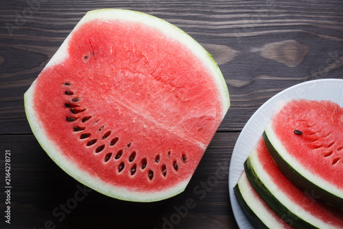 Pieces of ripe watermelon on wooden table