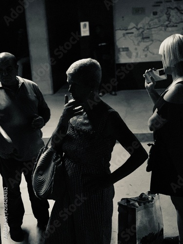 Black and White Street Photography Portrait of People Waiting