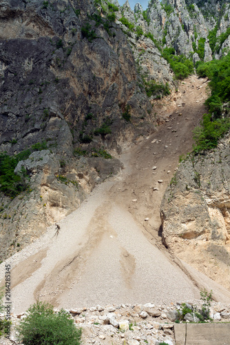 A sand slide as a result of constant rock erosion. Real photo. Adobe RGB color profile.