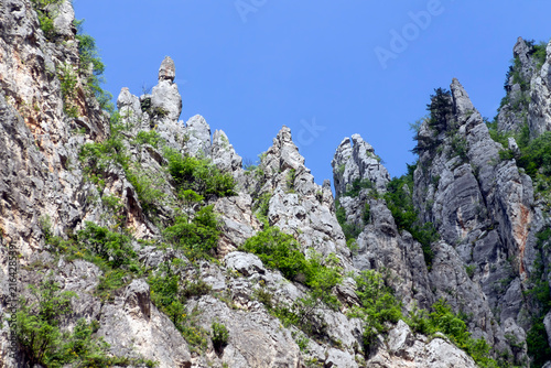 Stone structures and cliffs on top of the hill. view from the foothills. Real photo. Adobe RGB color profile.