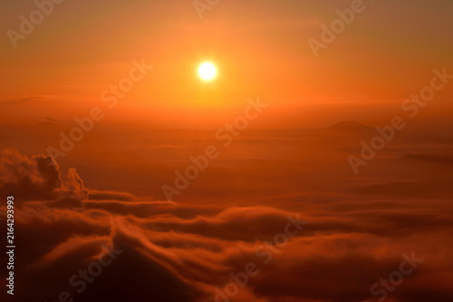 Bild auf Leinwand Dramatic sunset over a vast sea of inversion clouds in the Bohemian Highlands