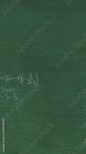 Animation of layers of mathematical formulae and equations over green chalkboard