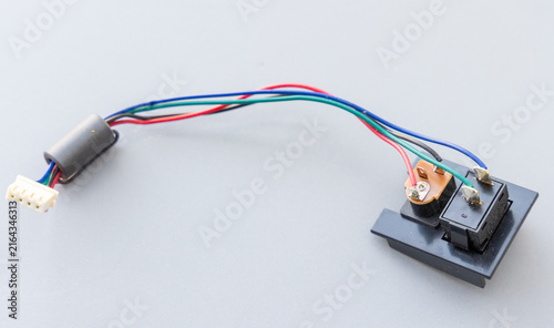 Obraz na płótnie Electronic module with colored wires, switches, ferrite bead, and connector