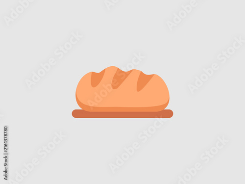 A freshly baked golden-brown loaf of bread sitting on a wooden board