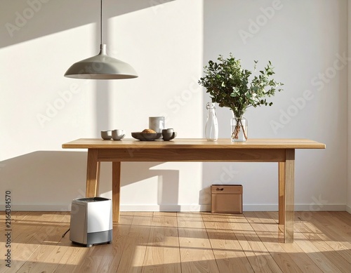 Minimalist home interior featuring a wooden table, plants, dishes, and electronic equipment