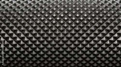 Detailed geometric diamond pattern surface macro photograph