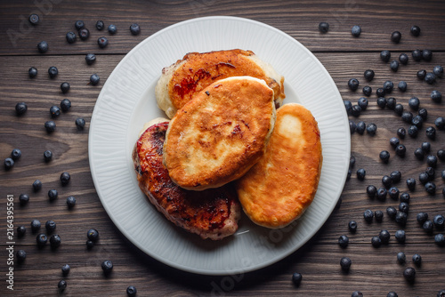 Fried common bilberry pies on plate