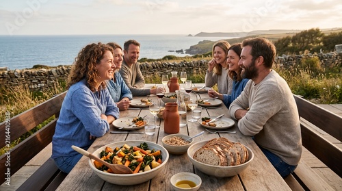 Friends settle into a coastal farm dinner