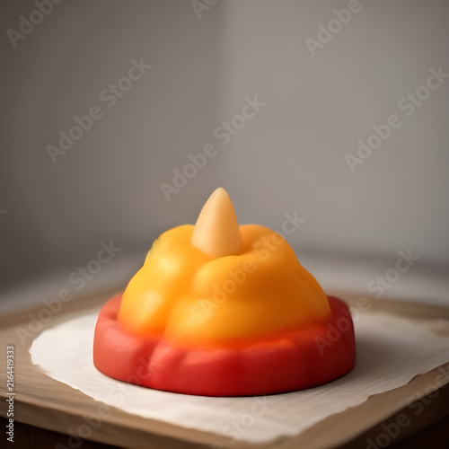 Colorful Mango and Red Fruit Dessert on Wooden Surface.