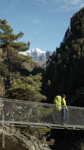 Konstfotografi A tourist with a backpack on the Hillary Bridge, Nepal.