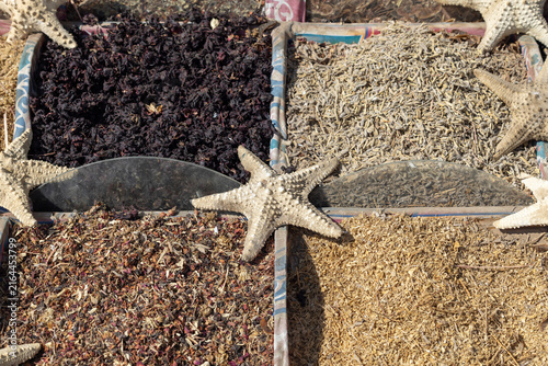 Dried starfish on traditional oriental spices and herbs in wooden boxes at Old Market, Sharm El Sheikh, Egypt