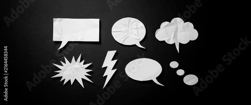 Set of vector crumpled paper speech bubbles isolated on black background in different shapes and forms for communication.